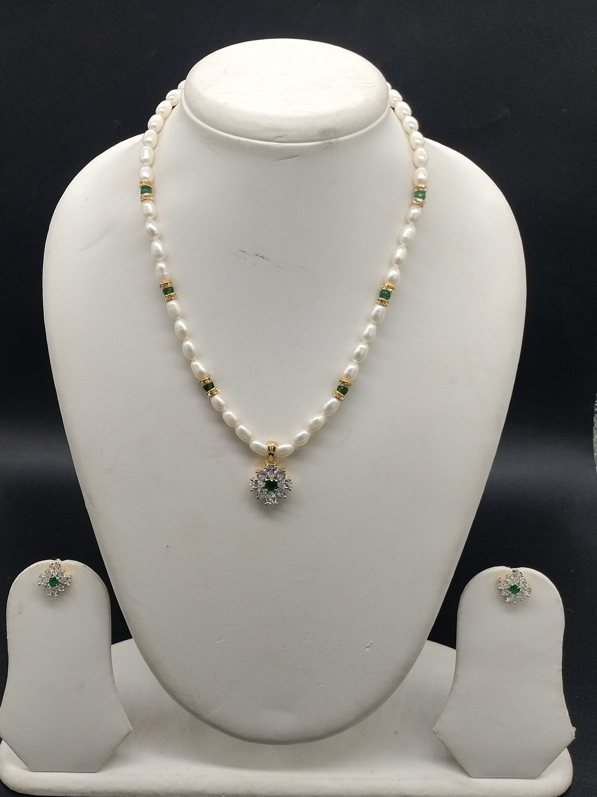White freshwater pearl pendant necklace set with green stone pendant and oval pearls