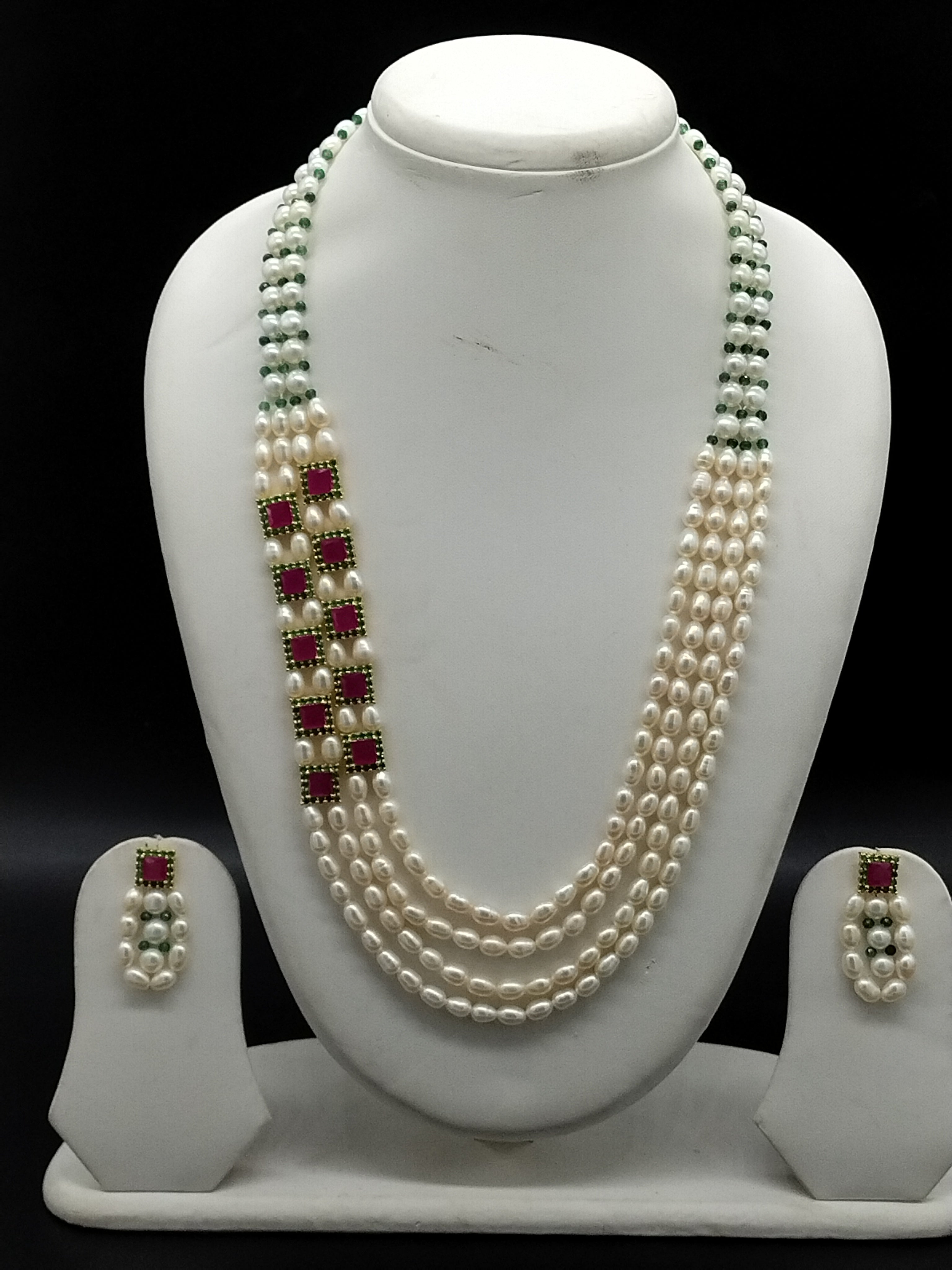 White freshwater pearl side brooch necklace set with four line pearls and red stone detailing