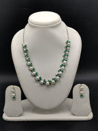 White pearl necklace set with green stones and white stones for women