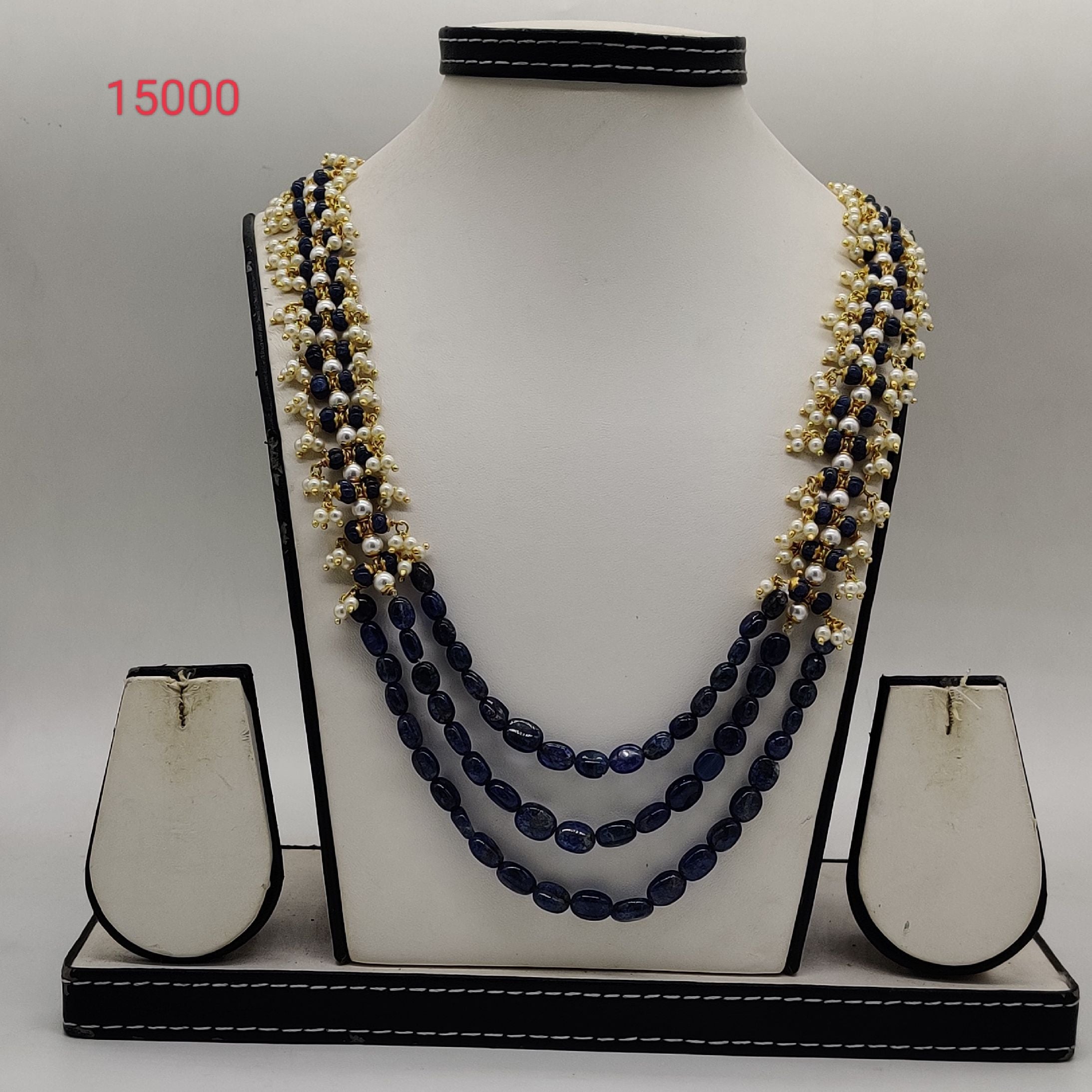 blue beaded pearl necklace set with white pearl clusters in multi strand design