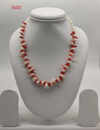 coral freshwater pearl necklace with white pearls and red coral fragments in organic design