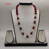 freshwater pearl necklace set with white pearls and red beads in long traditional design