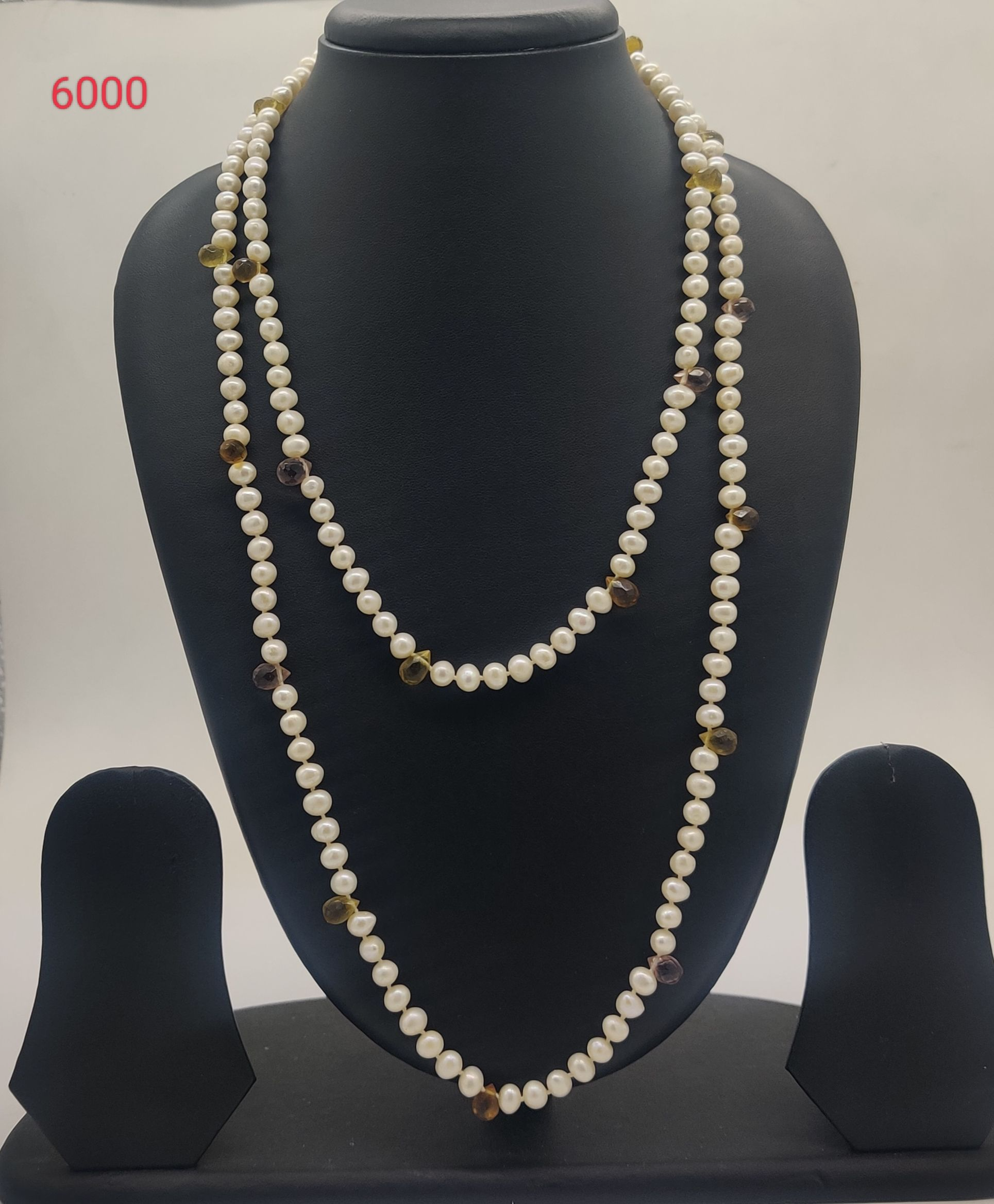 freshwater pearl necklace with white pearls and olive green brown gemstone accents in layered design