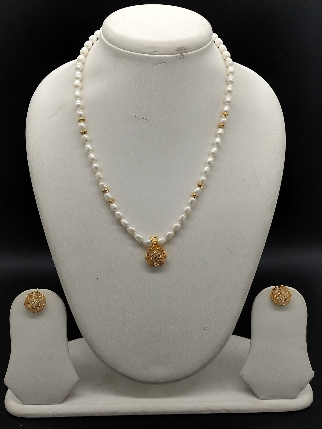 White freshwater pearl one line pendant necklace set with gold pendant and matching earrings