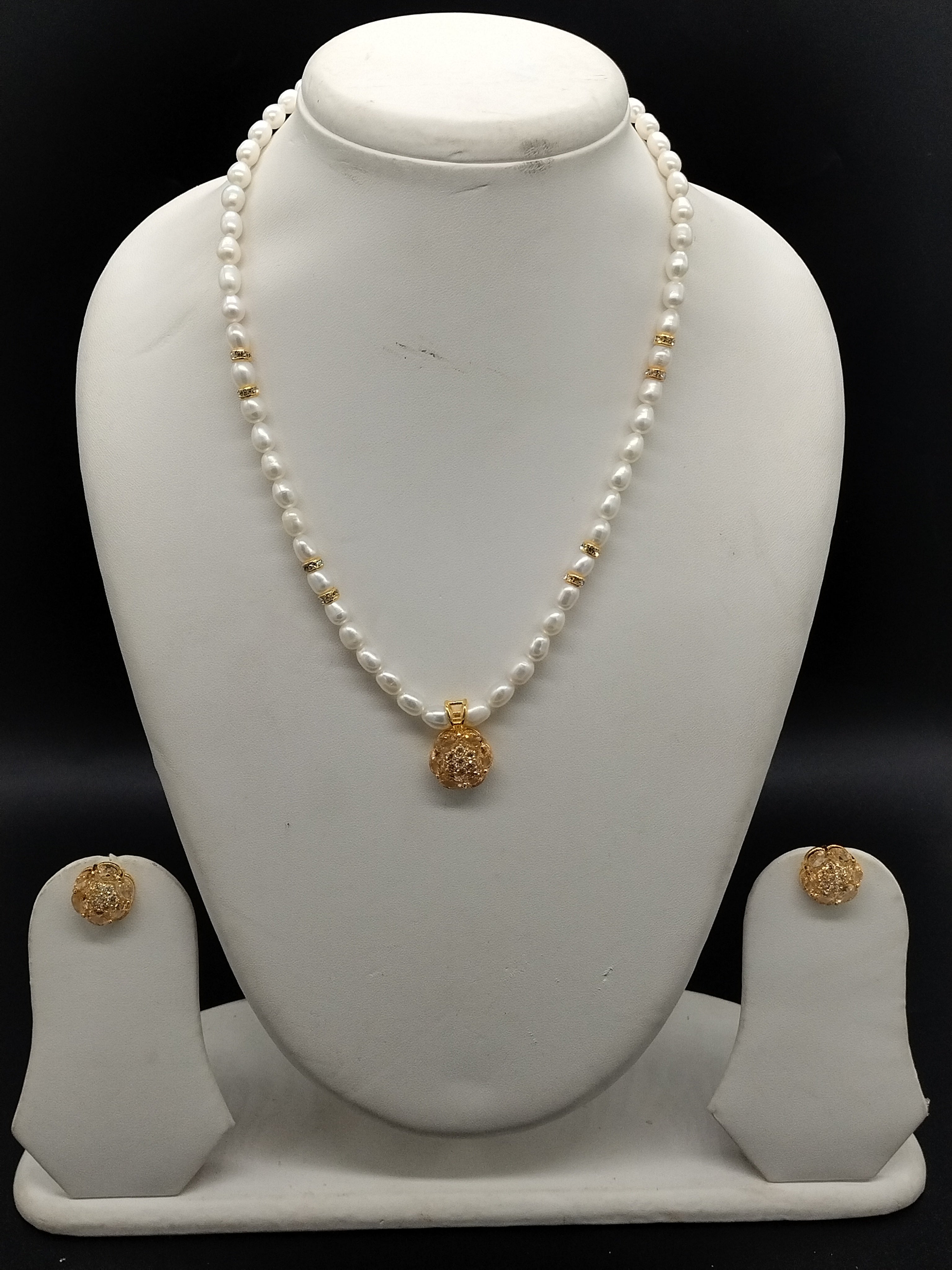 White freshwater pearl one line pendant necklace set with gold pendant and matching earrings