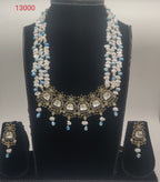 freshwater pearl polki pendant set with white and blue pearls and floral design with matching earrings