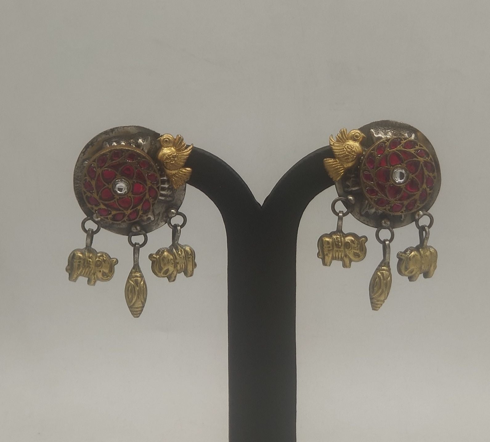 golden avian majesty oxidized silver earrings with bird motif red filigree and charm danglers