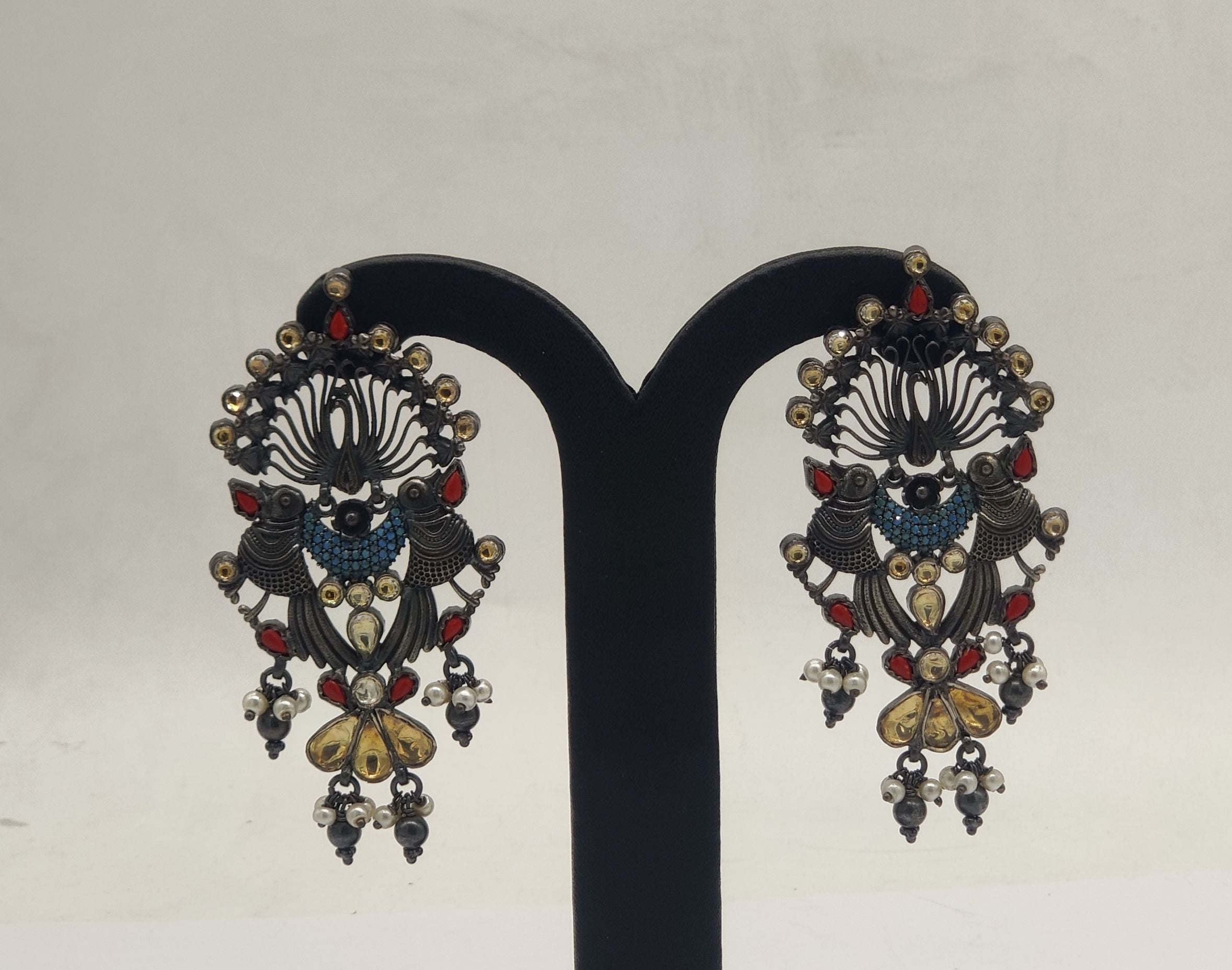 peacock royale oxidized silver earrings with multicolor stones and pearl bead danglers