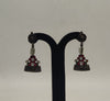 rakt pushpa oxidized silver jhumka earrings with red floral motif and bead accents