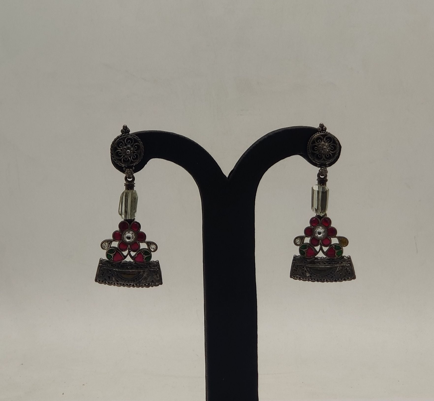 rakt pushpa oxidized silver jhumka earrings with red floral motif and bead accents