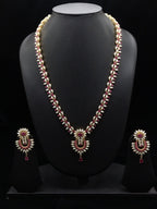 The Crimson Chevron: Rice Pearl Long Haar with Ruby Chandbali Pendant Set