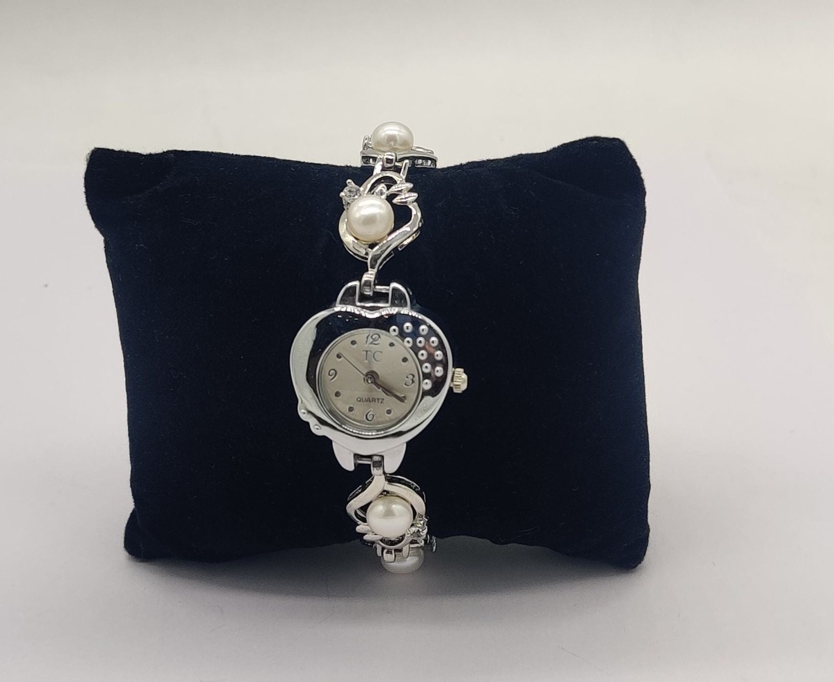 silver tone pearl designer bracelet watch for women with pearl accents