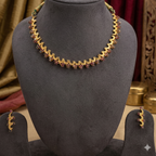 traditional gold tone temple necklace set with red stone design and matching earrings